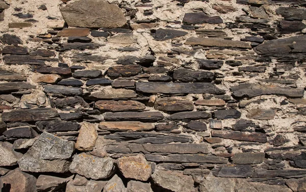 Detalj av en vägg av en gamla stenhus — Stockfoto