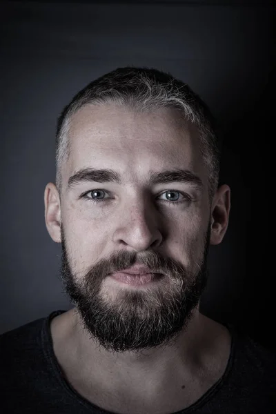 Portrait of a young man with a beard. Toned — Stock Photo, Image