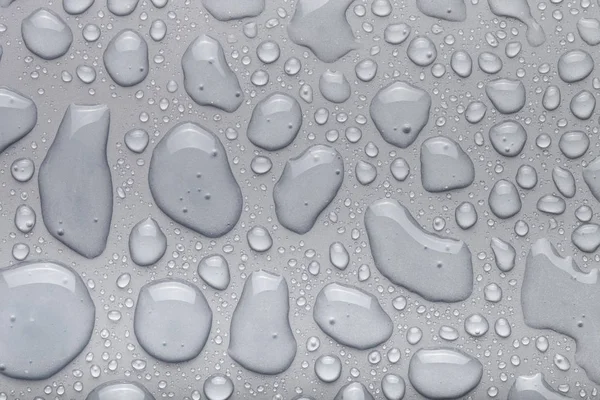 Drops of water on a color background. Gray. Shallow depth of fie — Stock Photo, Image