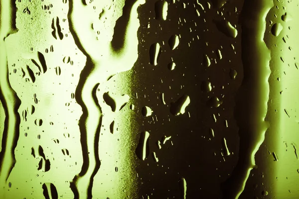 Gotas de água em cubos de gelo coloridos. Textura de fundo abstrata — Fotografia de Stock