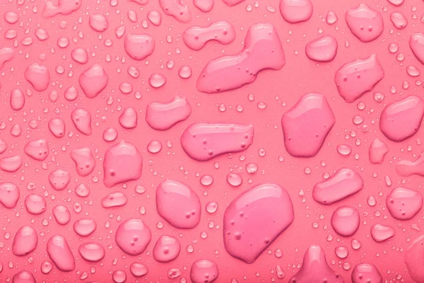 Gotas de água em um fundo a cores. Rosa. Tonificado — Fotografia de Stock