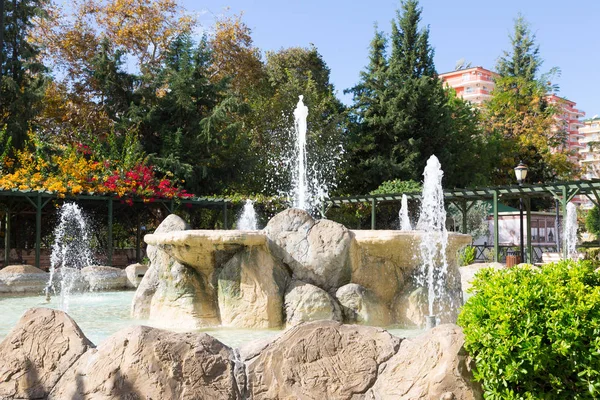 Beautiful fountain with natural stones in Mahmutlar district in — Stock Photo, Image