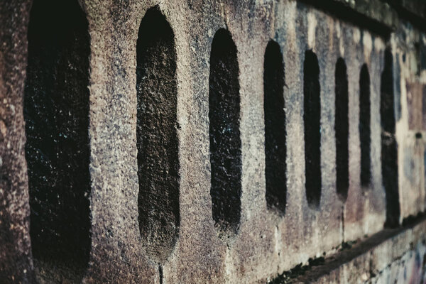 Abstract texture of gray brick wall background. Close up detail. Selective focus. Shallow depth of field. Toned.