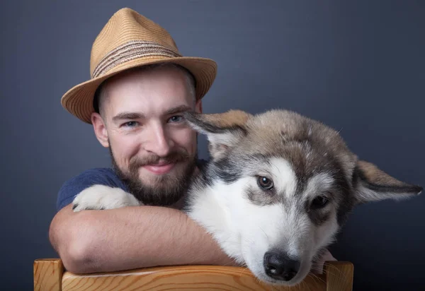 Portrait of a young man with a dog — Stock Photo, Image
