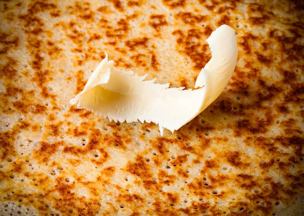 Stack of Russian pancakes - blini on a wite plate on old wooden — Stock Photo, Image