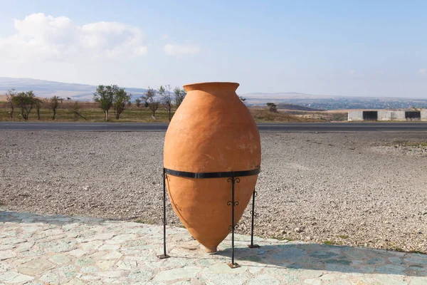 Ancient clay vessel near winery in Georgia on beautiful autumn l — Stock Photo, Image