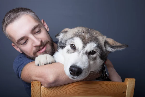 Portrait of a young man with a dog — Stock Photo, Image