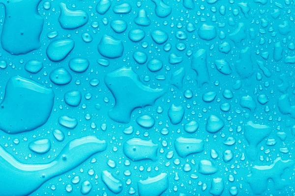 Vízcseppek színes háttérrel. Kék. Feltöltve — Stock Fotó