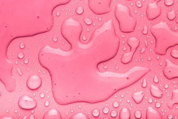 Gotas de agua sobre un fondo de color. Rosa. Tonificado — Foto de Stock