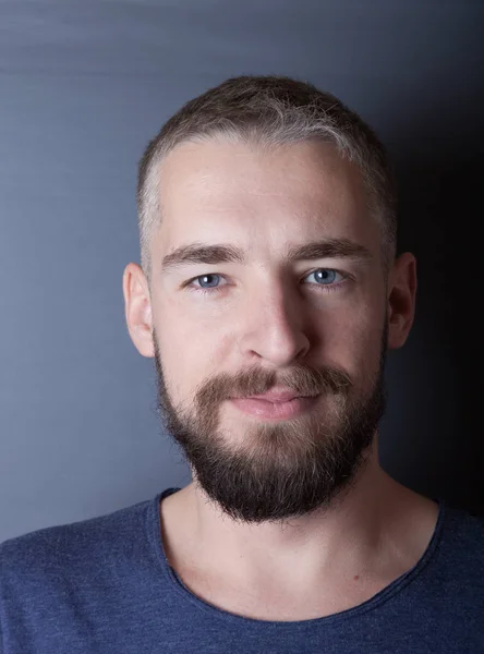 Portrait of a young man with a beard — Stock Photo, Image