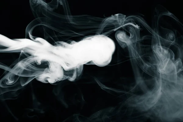 Nuvem de fumo no fundo preto. Foco seletivo. Tonificado — Fotografia de Stock