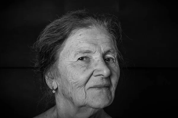 Portrait of elderly woman. Tricky glance. Toned — Stock Photo, Image