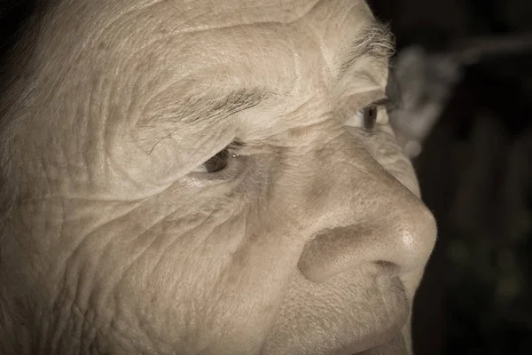 Portrait of elderly woman. Close-up detail. Toned — Stock Photo, Image