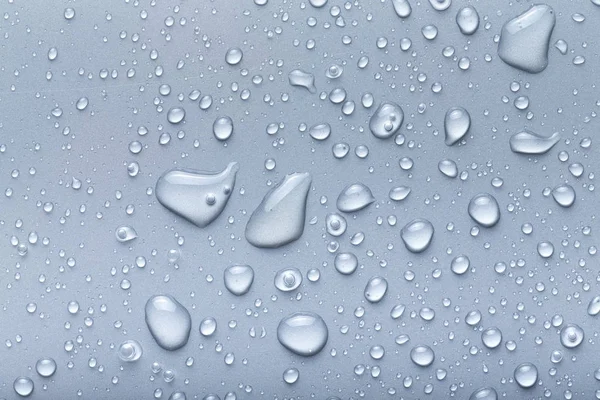 Gotas de agua sobre un fondo de color. Gris —  Fotos de Stock