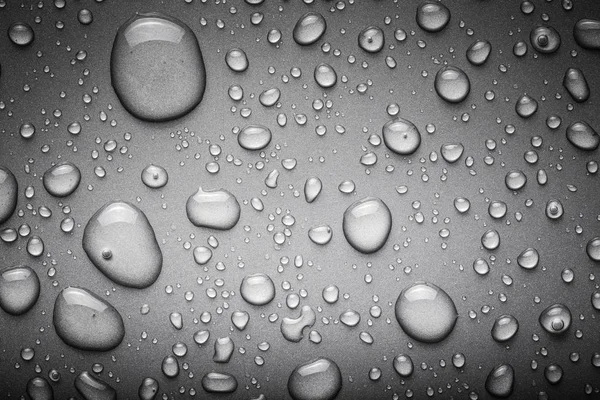 Gotas de água em um fundo a cores. Cinza. Tonificado — Fotografia de Stock