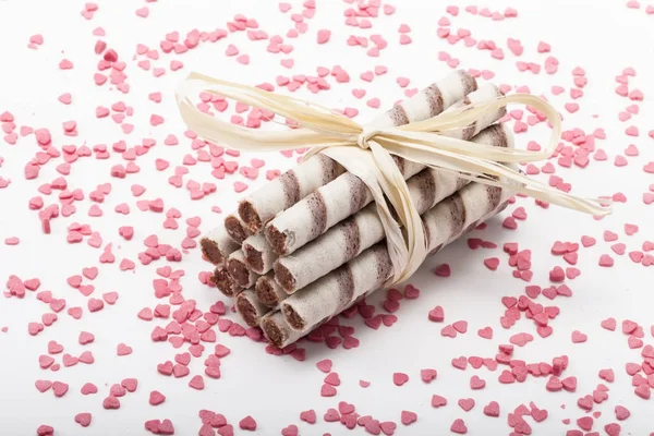 Waffles tied with a ribbon and sprinkled with sweet heart — Stock Photo, Image