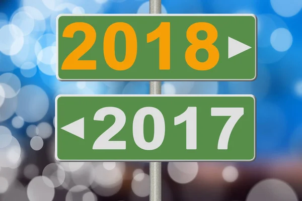 Tekenen 2017 en 2018 op een onscherpe achtergrond. Collage — Stockfoto