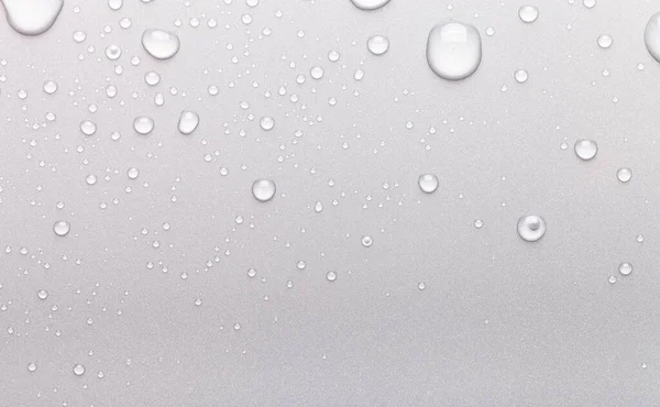 Gotas de agua sobre un fondo de color. Gris —  Fotos de Stock