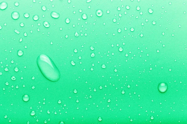 Drops of water on a color background. Green. Toned — Stock Photo, Image