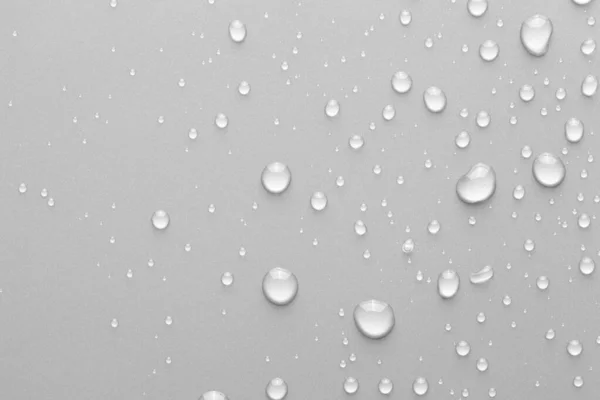 Gotas de agua sobre un fondo de color —  Fotos de Stock