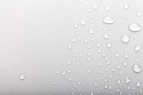 Gotas de água em um fundo a cores. Foco seletivo. Cinza — Fotografia de Stock