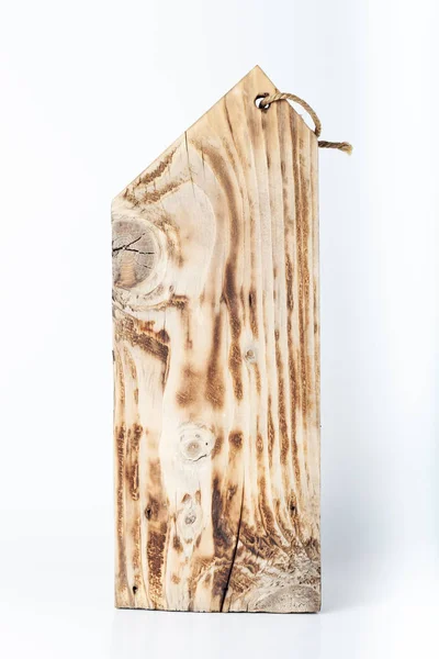 Handmade burned cutting board on a light background. Rough weath — ストック写真