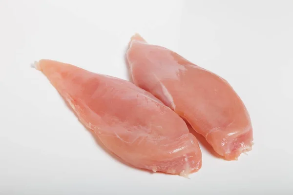 Rohes Chiken-Fleisch auf hellem Hintergrund — Stockfoto
