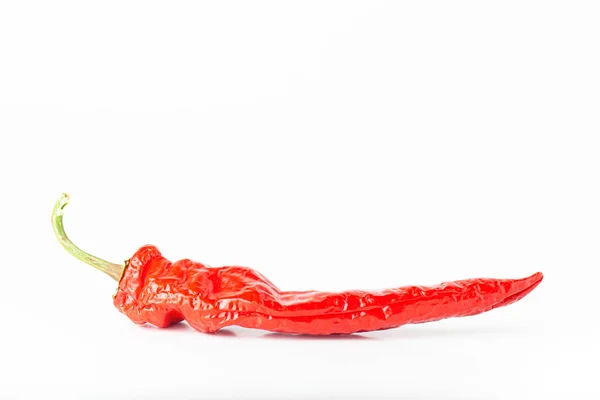 Bright red hot chili pepper isolated on white background — ストック写真