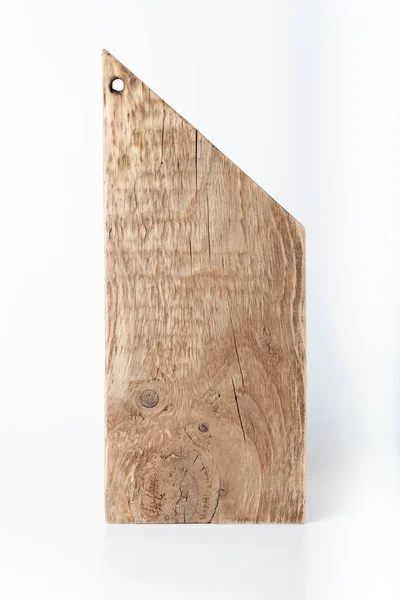 Handmade burned cutting board on a light background. Rough weath — ストック写真