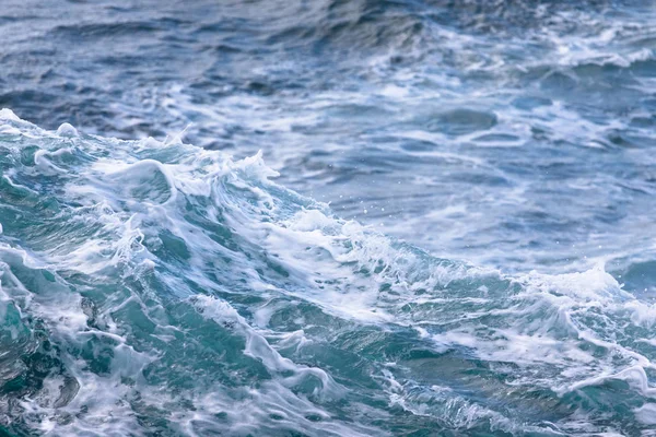 White crest of a sea wave. Selective focus. Shallow depth of fie — Stock Photo, Image