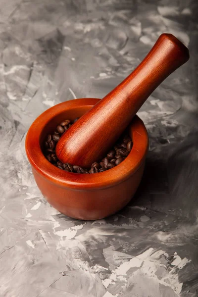 Composition with a coffee beans on a textured plastered backgrou — Stock Photo, Image