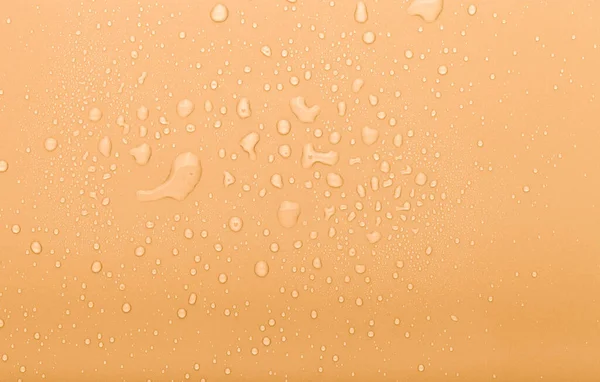 Druppels Water Een Gekleurde Achtergrond Oranje Toned — Stockfoto