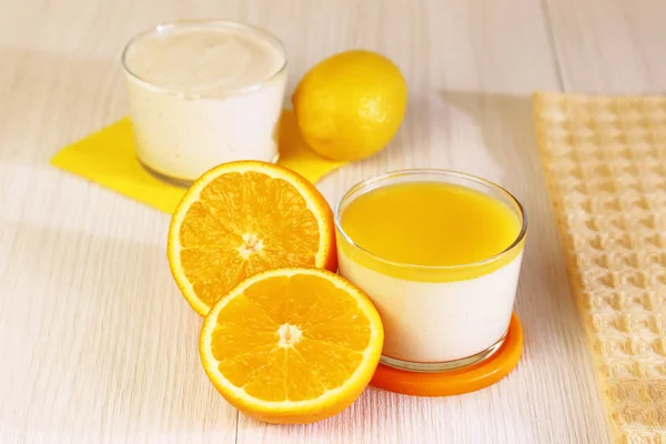 Food. Panna cotta. Italian milk fruity dessert made of yogurt and cream with lemon and orange. — Stock Photo, Image