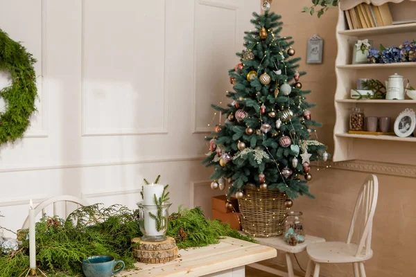 Christmas party table with branches of eve in living room — Stock Photo, Image