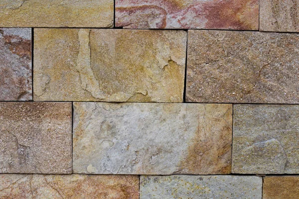 Decorative beige stone brick wall