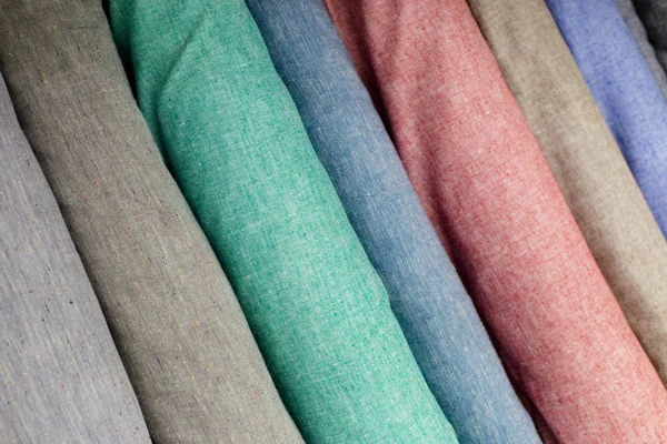 Colorful fabric swatches on shopfront — Stock Photo, Image