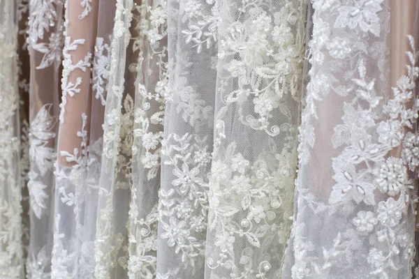 White and beige textile for wedding dresses on shopfront