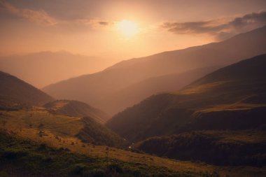 Sunset over caucasus mountain range in Georgia