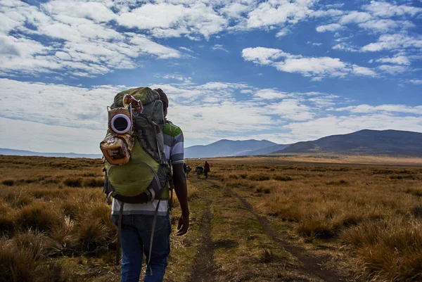 Hikein Ngorongoro Conservation Area Nationnal park Highlands craters en route for Bulati Village from Nainokanoka with Masai Guide and cook. The Crater Highlands (Ngorongoro Highlands) are a region along the East African Rift in the Arusha and Manyar