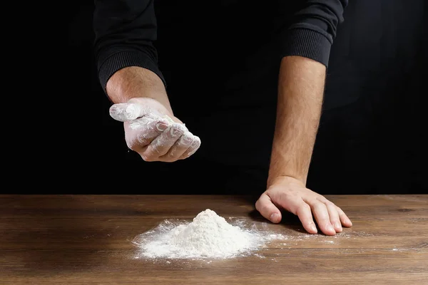Hands Cook Close Pour Flour Table Cook Dough Black Background — Stock Photo, Image