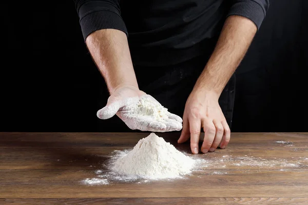 Hands Cook Close Pour Flour Table Cook Dough Black Background — Stock Photo, Image