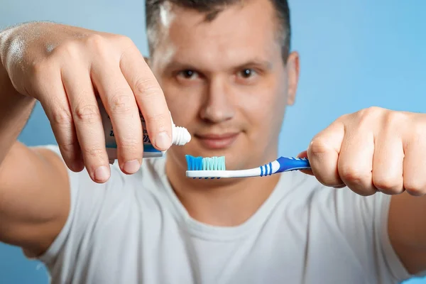 Close Attractive Young Man Brushing His Teeth Man Squeezes Toothpaste — Stock Photo, Image