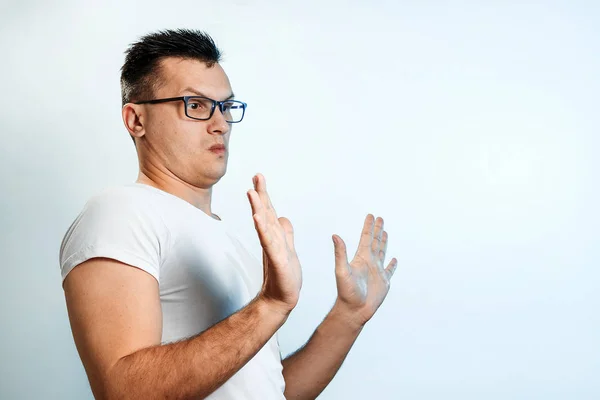 Attractive Young Man Makes Frightened Gesture Palms Defends Himself Someone — Stock Photo, Image