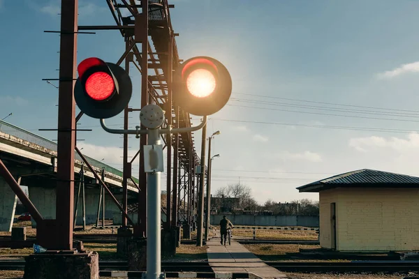 Railroad crossing, flashing traffic light.