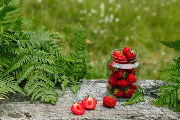 Strawberries Glass Jar Wooden Gray Table Green Background Leaves Paparatnik — Stock Photo, Image