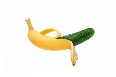 Green cucumber in a banana peel on a white background, isolate. Genetically modified fruit. Image computer collage. The concept of GMF. Not what it seems, a deception, a paradox. clipart