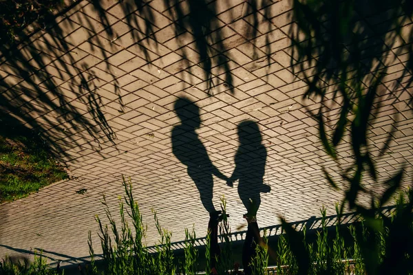 Shadows Loving Couple Holding Hands City Center Cobblestones Sunny Day — Stock Photo, Image