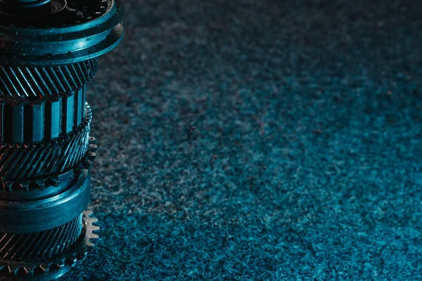 Gears and bearings on a dark background. Automotive concept. Copy space