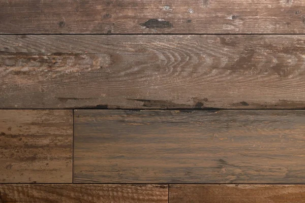 The texture is a wooden brown floor. brown wood, boards, parquet.