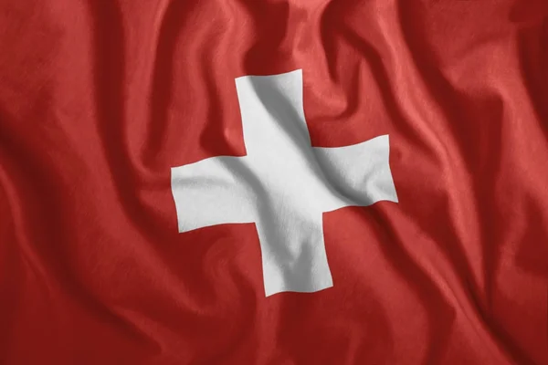 A bandeira suíça treme ao vento. Bandeira nacional colorida da Suíça. Patriotismo . — Fotografia de Stock